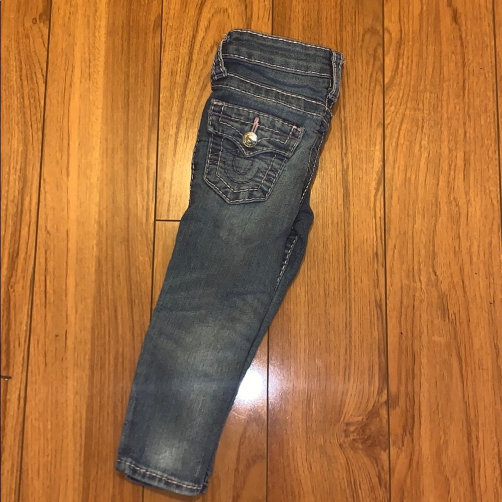 A toddler girl true religion